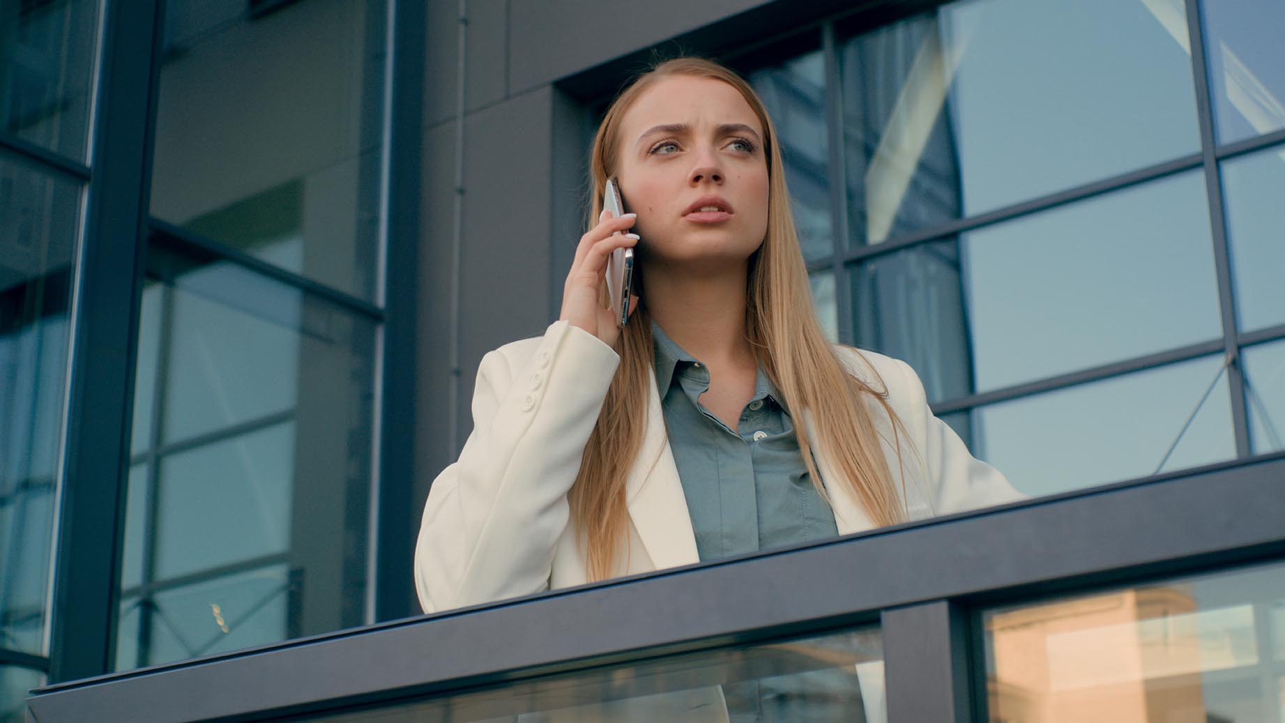 Strict dissatisfied angry Caucasian businesswoman woman female talking mobile smartphone phone answering call. Employee girl manager discuss problem explaining business plan argue city outside office. High quality 4k footage